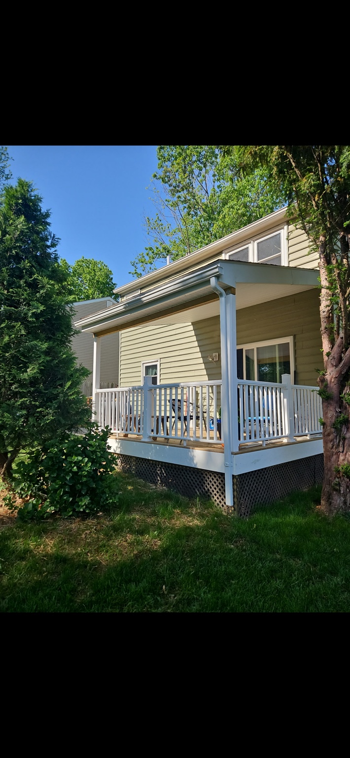 Completed deck and covered patio project by Woodpecker Home Improvements LLC